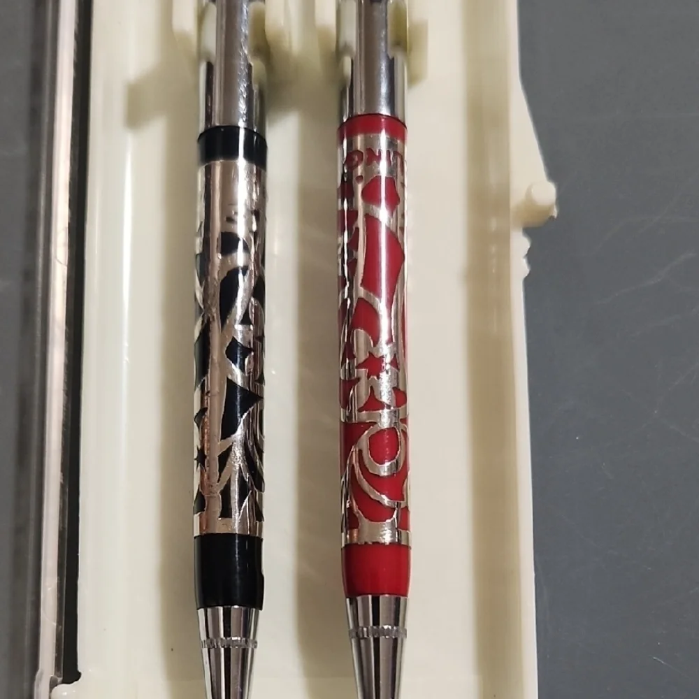 Elegant Silver and Patterned Pens Set